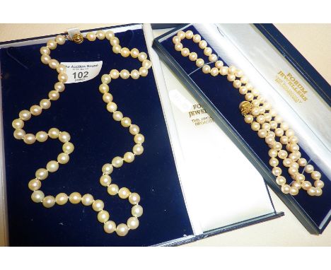 Pearl necklace in case with 9ct gold clasp, approx. 24.5" long. Together with another (faux pearls) with silver clasp