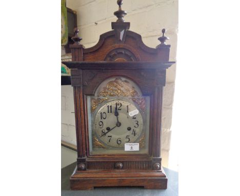 Victorian oak cased mantle clock with arched dial