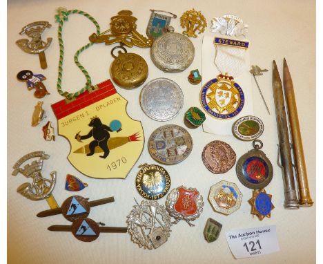 Assorted badges, some mounted silver coins, military cap badges, Eversharp pencils, etc.