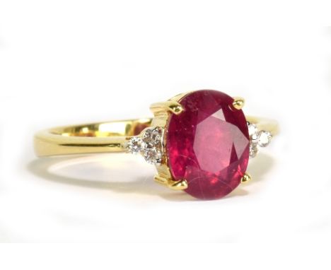 An 18ct yellow gold Madagascan ruby and diamond ring, the principal ruby weighing approx 1.68cts with six tiny diamonds to th