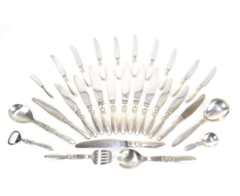 GEORG JENSEN; a silver handled flatware service decorated in the Cactus pattern, also a matching caddy spoon and bottle opene