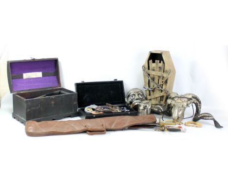 A group of props collected by the Great Stromboli comprising 'Zoltan' fortune teller, sets of handcuffs, model coffin etc. Pr