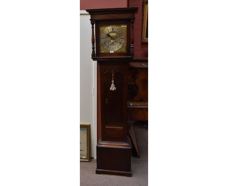 An 18th century oak and mahogany cross-banded thirty-hour longcase clock, the twelve inch brass dial set with silvered chapte