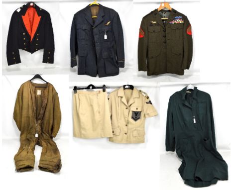 A group of military uniform including a khaki jumpsuit, size 5, beige lady's blouse and skirt, Royal Artillery dress blouse, 