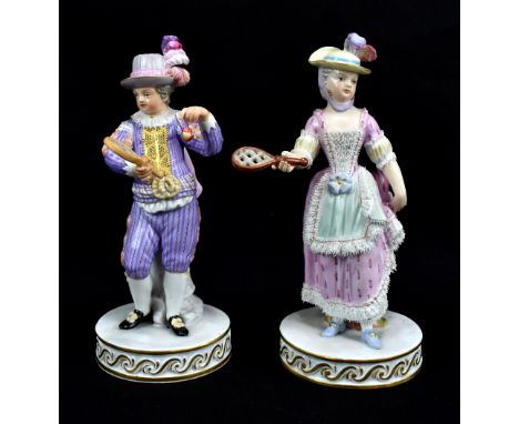 MEISSEN; a pair of mid-19th century shuttlecock players, each with blue painted crossed swords mark to base and incised numbe