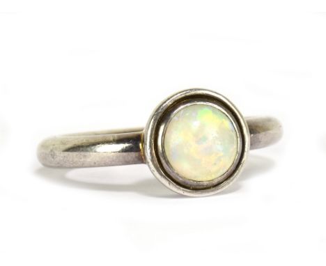 A silver and opal cabochon ring, size N, approx 5.8g.