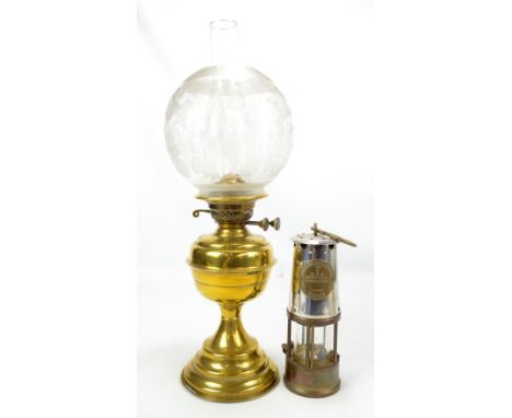An Eccles Protector lamp and lighting Type 6 safety lamp, height 25cm, also a brass oil lamp, with a floral decorated glass s