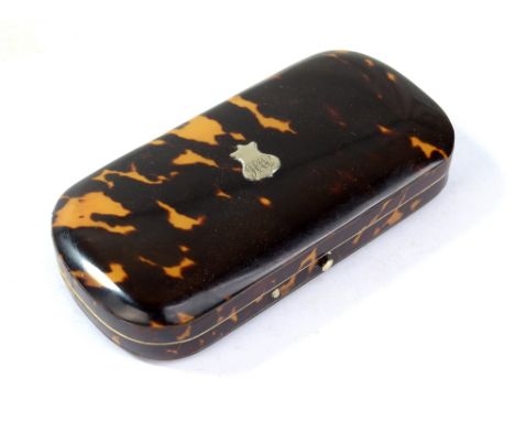 A late 19th/early 20th century rounded rectangular tortoiseshell sewing case, incomplete, with mother of pearl handled sewing