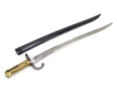 A French 1866 pattern yataghan bladed Chassepot-type bayonet and scabbard, inscribed 'St Etienne, Janvier 1868[?]', length 71