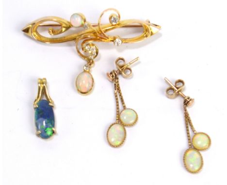 A 9ct yellow gold Art Nouveau diamond and opal set pierced brooch, in fitted Lloyd, Payne &amp; Amiel of Manchester jewellery