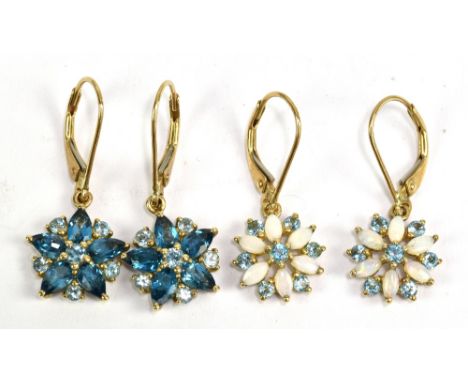 A pair of 9ct yellow gold opal set floral ear studs and a further pair of floral ear studs, approx 4.5g.