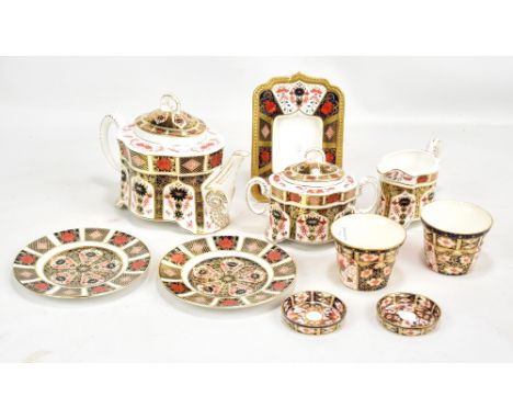 ROYAL CROWN DERBY; an old Imari pattern teapot, sugar pot, creamer, also an Iamri patterned photoframe (af), etc, (10).Additi