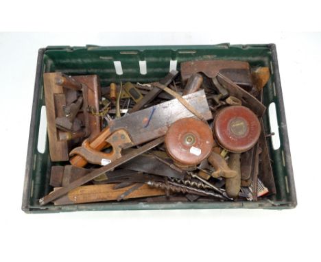 A group of woodworking tools including plane, saws, further tools, two leather bound tape measures, etc.Additional Informatio