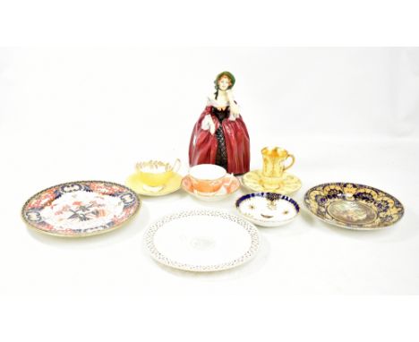 A collection of 19th century and later ceramic figures to include a Wedgwood creamware plate with a central roundel depicting