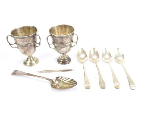 A small group of hallmarked silver to include a pair of Charles Boyton &amp; Son Ltd three handled trophies, London 1902, fou
