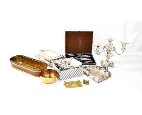 A quantity of assorted silver plate, to include a four branch candle holder, various flatware, entree dish, also a brass boun