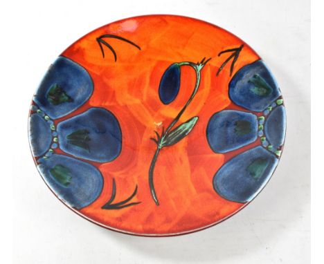 A Poole Pottery charger decorated in a Himalayan poppy pattern, diameter 42cm, with original label.