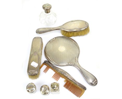 W G SOTHERS &amp; CO/LTD; a George V hallmarked silver mounted five piece dressing table set comprising mirror, clothes and h