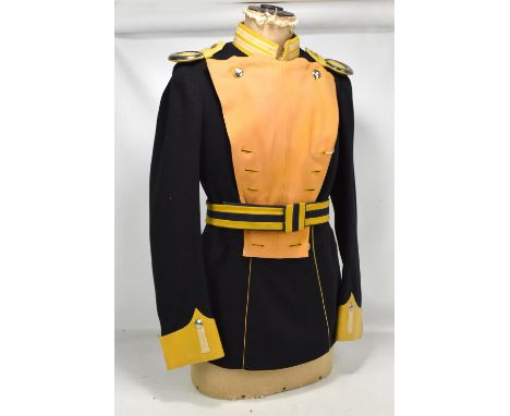 A navy and yellow coatee with metal mounted epaulettes and belt/sash with stitched label inscribed 'Rohstoff'.