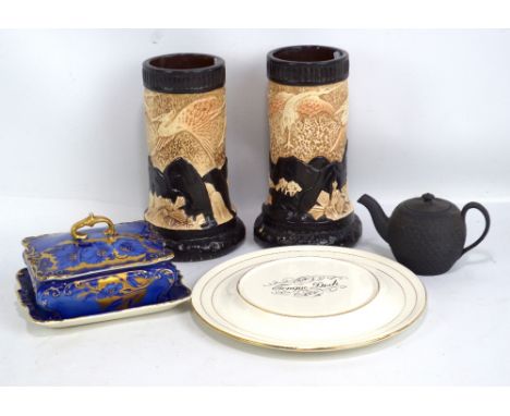 A 19th century Wedgwood black basalt teapot, having basket weave decoration, height 9cm, a pair of Bretby vases, decorated wi