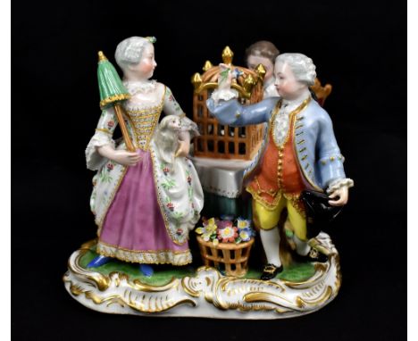 VIENNA; a porcelain group of a lady, cavalier and gentleman playing the recorder, circa 1860, impressed beehive marks to base