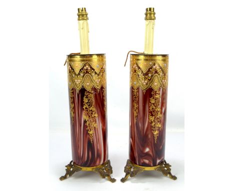 A pair of 20th century Venetian table lamps of circular form, having gilt and hand painted floral decoration on a ruby and mi