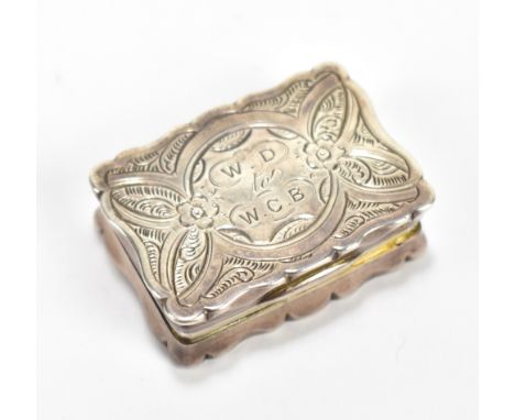 GEORGE UNITE; a Victorian hallmarked silver vinaigrette, the exterior with bright cut foliate decoration and inscribed 'W.D t