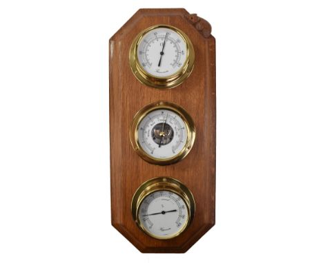 ROBERT THOMPSON OF KILBURN; a 'Mouseman' weather centre set with brass cased thermometer, barometer and hygrometer, with carv