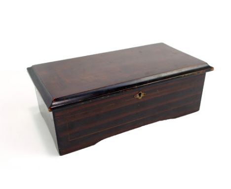 A late 19th century six air musical box, contained in a stained wooden case, height 12cm, length 34.5cm.Additional Informatio