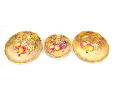 ROYAL WORCESTER; two handpainted and gilt heightened decorative plates, signed J. Reid, diameter 20cm, also a similar smaller
