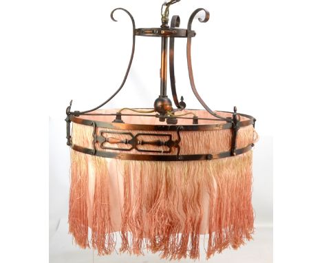 An early 20th century Art Nouveau copper ceiling light with pierced frame and silk drop.&nbsp;