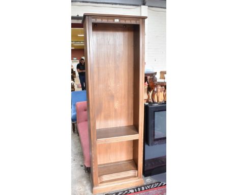 ERCOL; a 'Golden Dawn' open bookcase set with adjustable shelves, width 64cm.