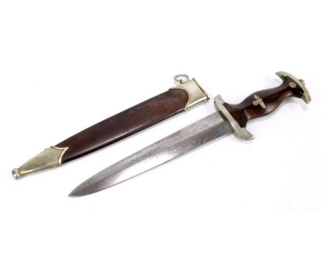 An early German Third Reich SA dagger with spread eagle and swastika set to the grip with nickel silver mounts and Eickhorn o