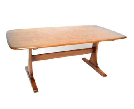 ERCOL; a large 'Golden Dawn' coffee table of rounded rectangular form, length 128cm.