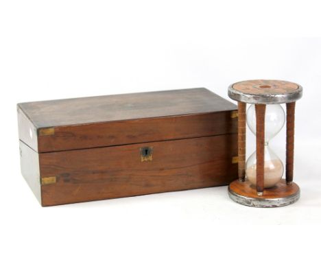 A 19th century brass bound writing slope with fitted interior and gilt tooled writing surface, width 44.5cm, and an egg timer
