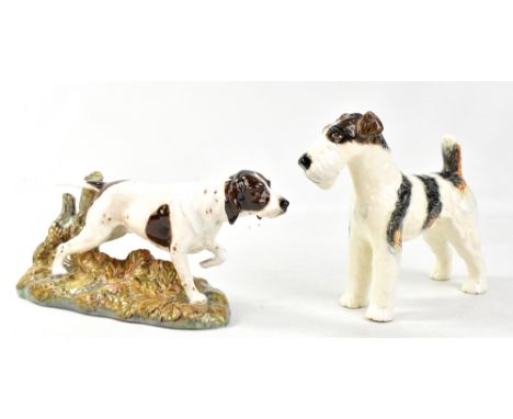 ROYAL DOULTON; a ceramic figure of a hunting dog, signed to base HN262, length 28cm, and a Wedgwood &amp; Co Ltd dog figure (