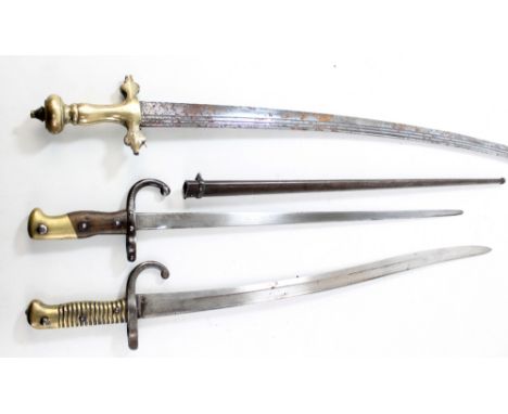 A Chassepot-type bayonet, a further bayonet with scabbard and a sabre/hanger (3).Provenance: The Great Stromboli.Additional I