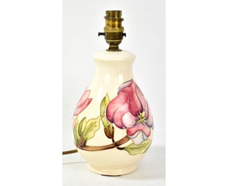 MOORCROFT; a tubeline decorated 'Magnolia' pattern baluster lamp base on cream ground, impressed marks and year cipher for 19