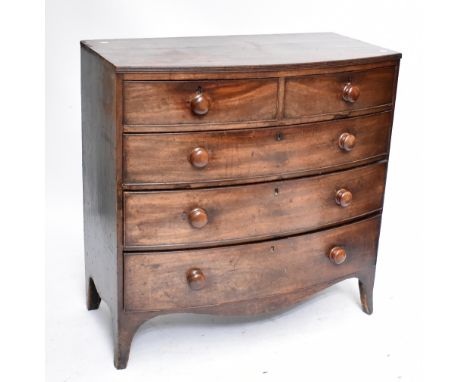 An early 19th century mahogany bowfronted chest of two short and three long graduated drawers raised on splayed bracket feet,