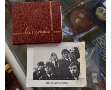 A promotional photograph believed to have been signed by Bill Wyman and Charlie Watts, 10.5 x 14cm total (worn), and an autog