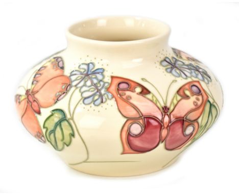 MOORCROFT; a tube line decorated 'Butterfly' pattern squat vase on cream ground, WM monogram with impressed marks and year ci