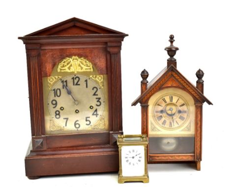 A brass cased carriage clock, the plain circular dial set with Roman numerals, height excluding swing handle 11cm, also a Ger