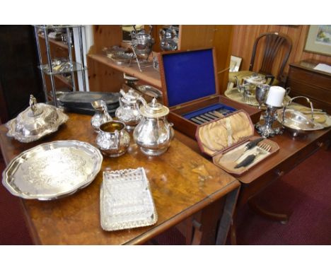 A selection of silver plated wares to include three piece tea set, planished basket, candlestick, fish cutlery, entree dish, 