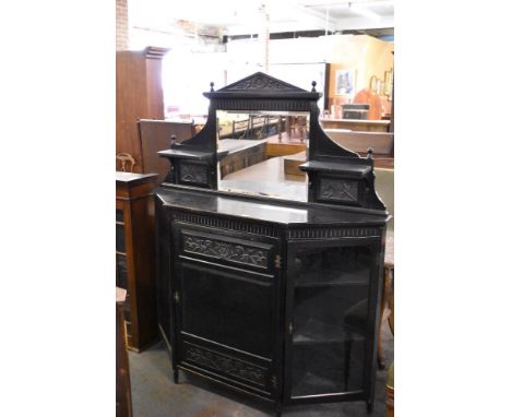 A Victorian aesthetic period ebonized wood credenza, of architectural form decorated with panels of carved foliage 167CM. X 1