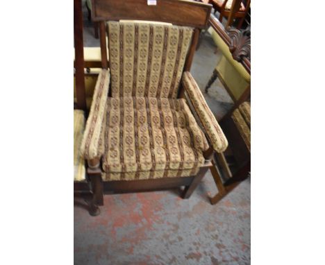 A late George III mahogany commode armchair, later upholstered. Seat height 42CM