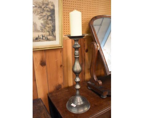 A cast metal pricket candlestick, of traditional turned design. 51CM.