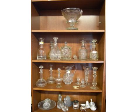 A quantity of mixed glasswares, comprising decanters, biscuit barrel, jug, vase, candlestick, condiment, bottles.
