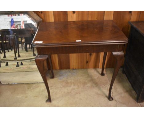 A 20th century figured mahogany card table, with folding top and swivel action.  Small depletion to front foot.