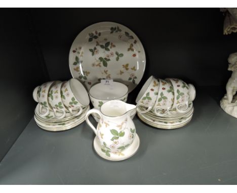 A vintage part tea service by Wedgwood in the Wild Strawberry pattern