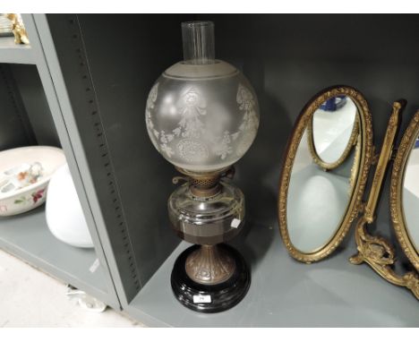A vintage oil lamp with etched shade glass well and pressed copper baseCR - Reserroir few small chips and marks. base seems o